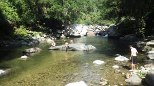 Soaking up some sun in the cool waters of the Buritaca river